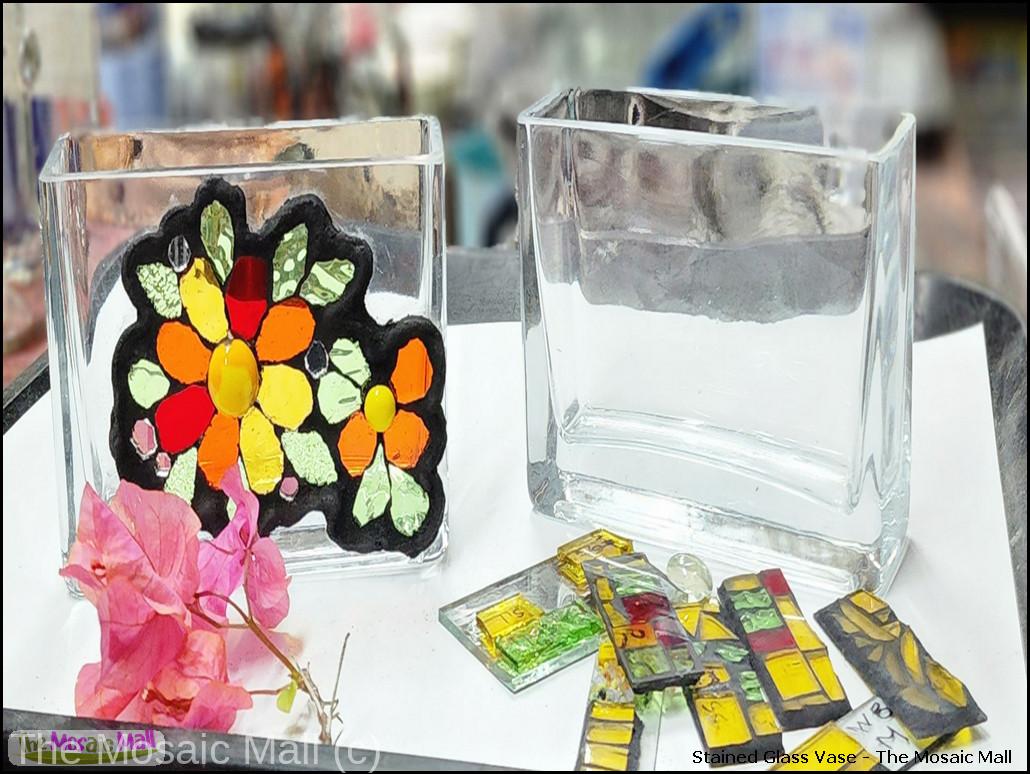 Decorate a glass vase with stained glass mosaics.